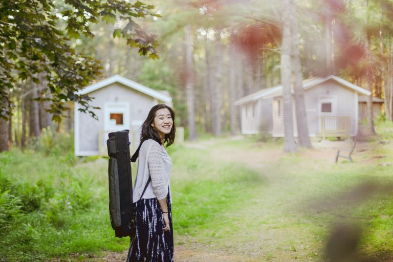 Returning student in front of practice studios