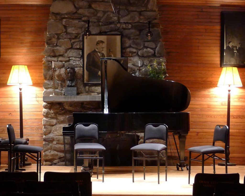 Fireplace and piano in the music hall